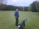 Posing, happy, pissed off with golf? Who knows!